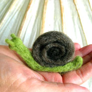 snail on a hand 2009